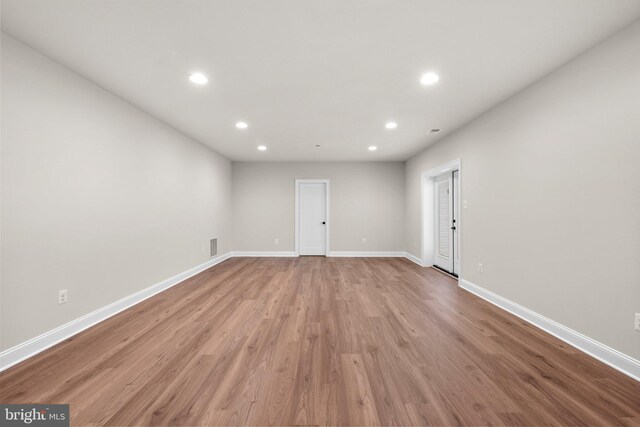 spare room with light wood-type flooring