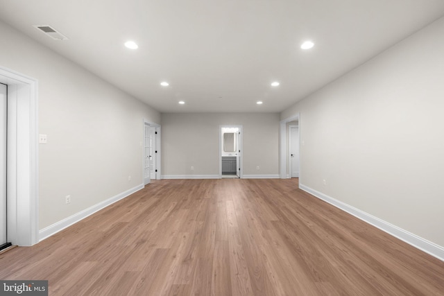 unfurnished living room with light wood-type flooring