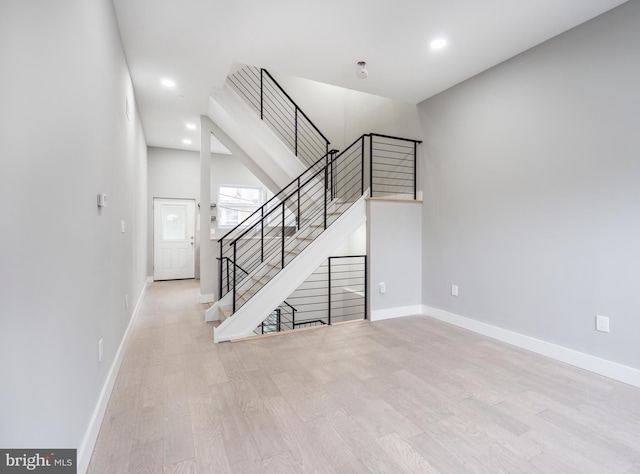 staircase featuring hardwood / wood-style flooring