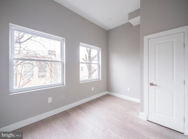 unfurnished bedroom featuring light wood-type flooring