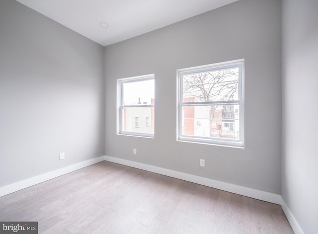 unfurnished room with light hardwood / wood-style flooring