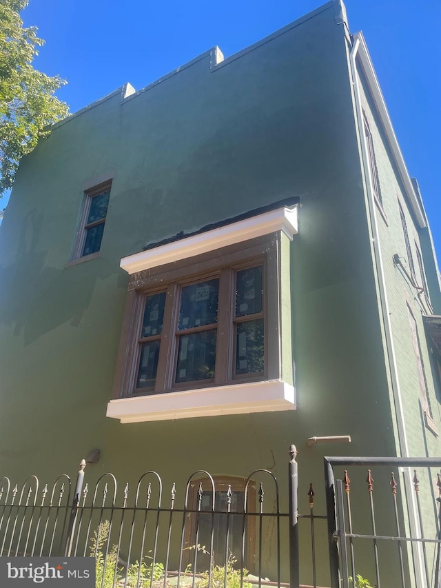 518 Columbia Rd NW, Washington, DC 20001 - view of home's exterior featuring stucco siding