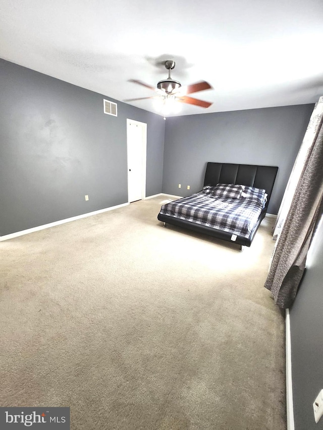 bedroom featuring ceiling fan and carpet floors