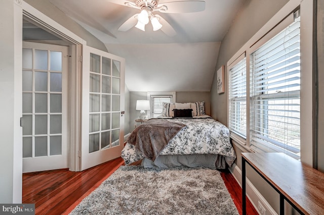 bedroom featuring vaulted ceiling, ceiling fan, and dark hardwood / wood-style floors