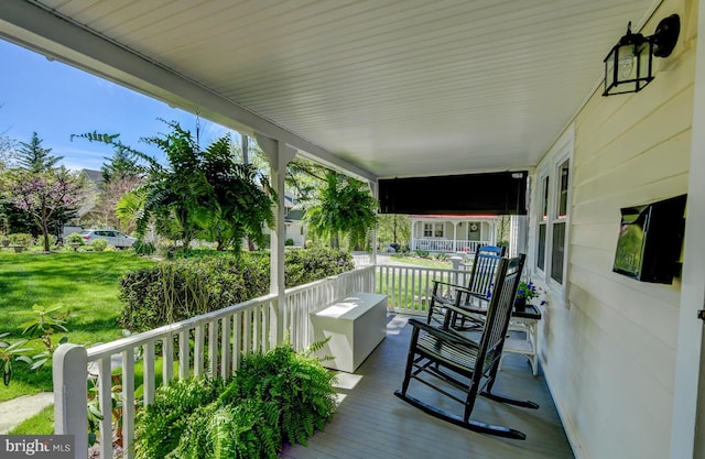 view of patio featuring a porch