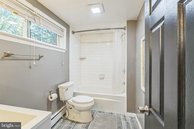 bathroom with shower / bath combination with curtain, a baseboard radiator, and toilet