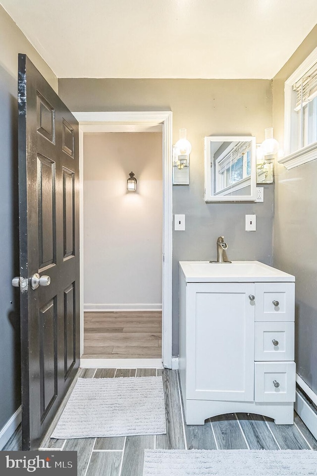 bathroom featuring vanity and a baseboard radiator