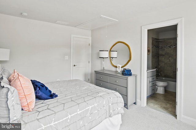 carpeted bedroom featuring ensuite bath