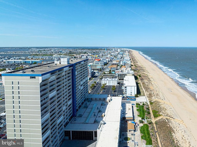 bird's eye view with a water view and a view of the beach