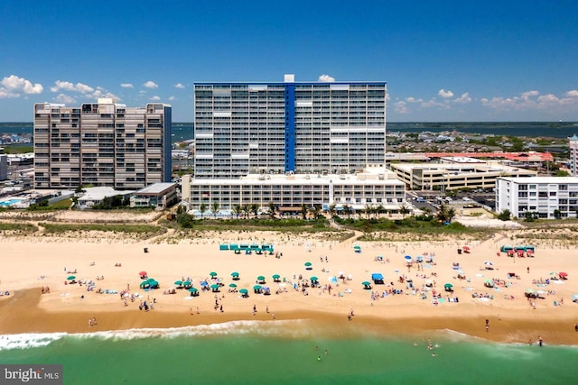 birds eye view of property featuring a water view and a view of the beach