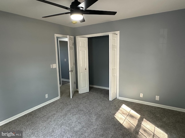 unfurnished bedroom featuring a closet, ceiling fan, and carpet flooring