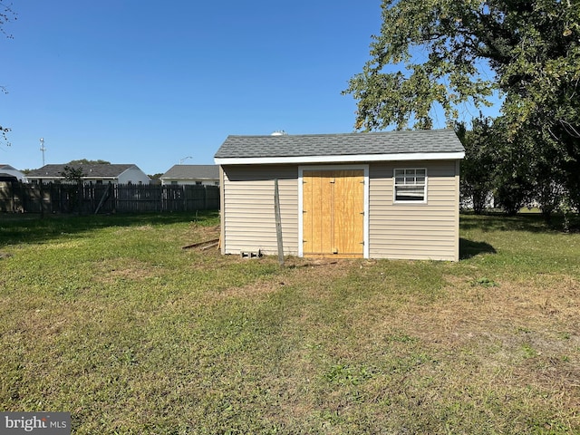 view of outdoor structure with a yard