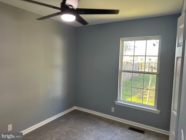 spare room featuring ceiling fan and carpet floors