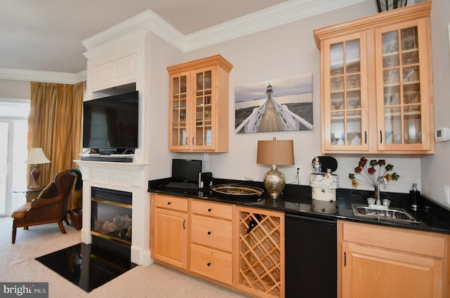 bar featuring carpet floors, wet bar, a sink, a glass covered fireplace, and crown molding