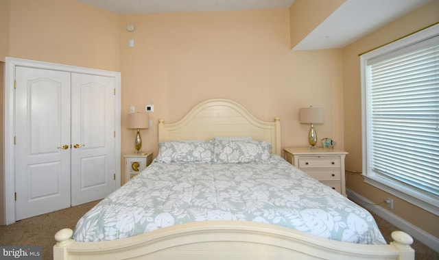 carpeted bedroom with a closet