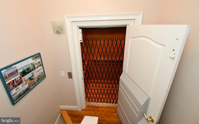 9 134th St Unit 9A, Ocean City, MD 21842 - elevator with baseboards and wood finished floors
