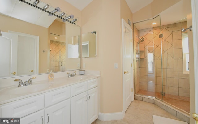 full bath featuring tile patterned flooring, a shower stall, double vanity, and a sink