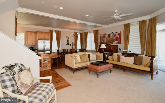 living room with recessed lighting, ornamental molding, and ceiling fan with notable chandelier