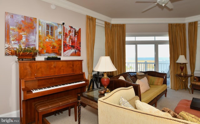 carpeted living area featuring ceiling fan and ornamental molding