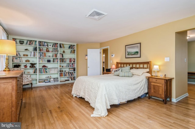 bedroom with light wood-type flooring