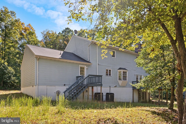 back of property featuring a deck