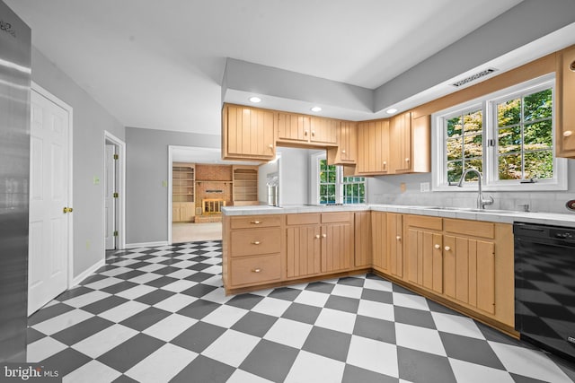 kitchen with light brown cabinets, dishwasher, sink, kitchen peninsula, and backsplash