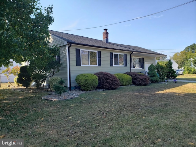 view of property exterior with a lawn