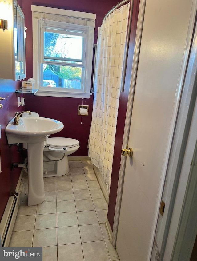 bathroom featuring baseboard heating, tile patterned floors, curtained shower, and toilet