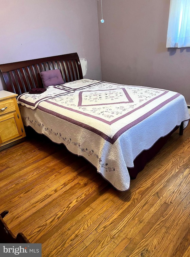 bedroom featuring hardwood / wood-style floors