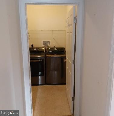 washroom featuring washing machine and dryer