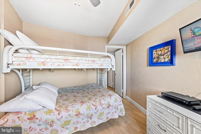 bedroom featuring light wood-type flooring and ceiling fan