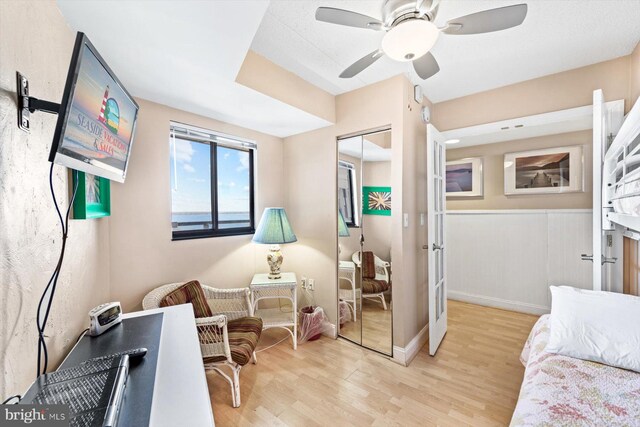 bedroom featuring a closet, ceiling fan, and light wood-type flooring