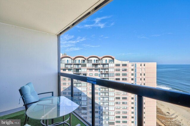 balcony featuring a water view