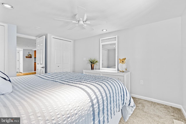 carpeted bedroom featuring ceiling fan, recessed lighting, visible vents, and baseboards
