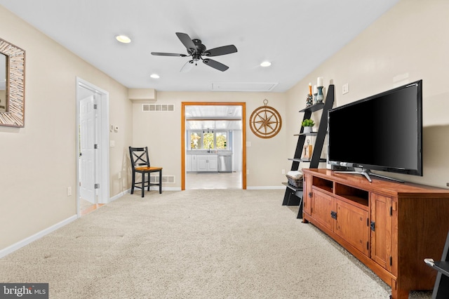 living area featuring attic access, recessed lighting, ceiling fan, visible vents, and baseboards