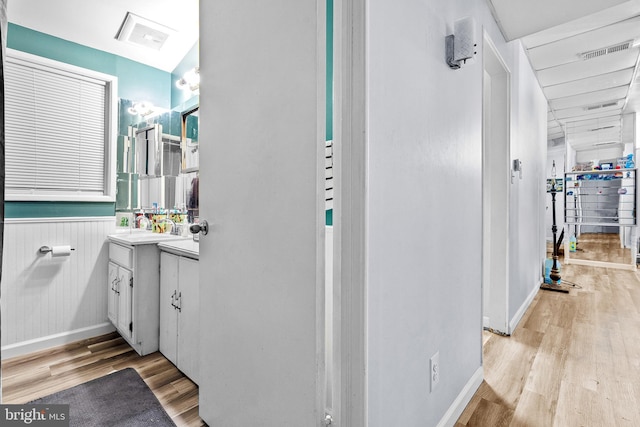 bathroom with vanity and hardwood / wood-style floors