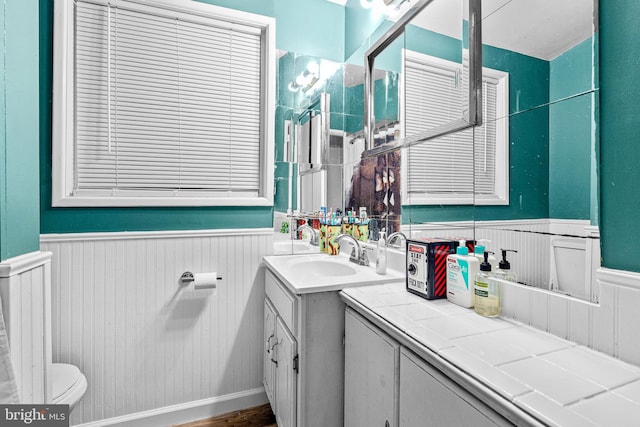 bathroom featuring toilet and vanity