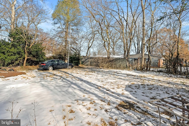 view of yard layered in snow