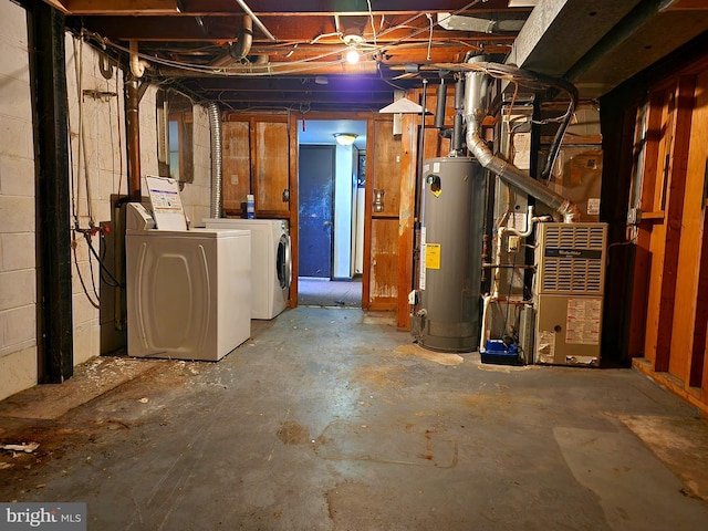 basement with washing machine and clothes dryer and gas water heater