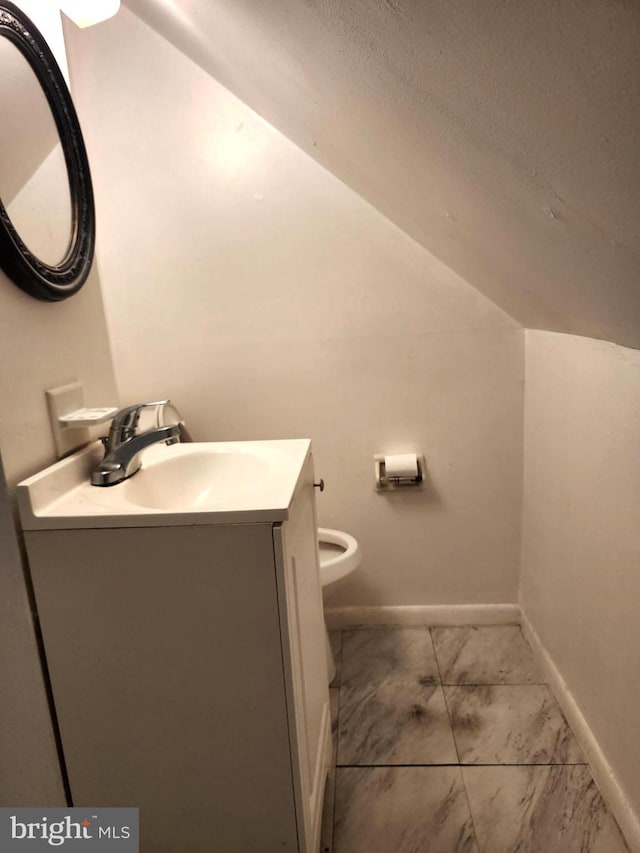 bathroom with toilet and vanity