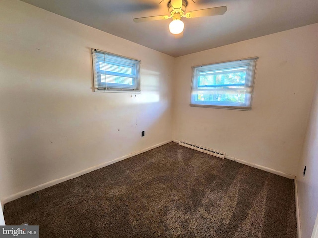 carpeted empty room with a baseboard heating unit and ceiling fan