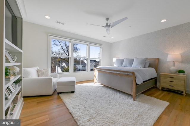 bedroom featuring wood-type flooring and ceiling fan