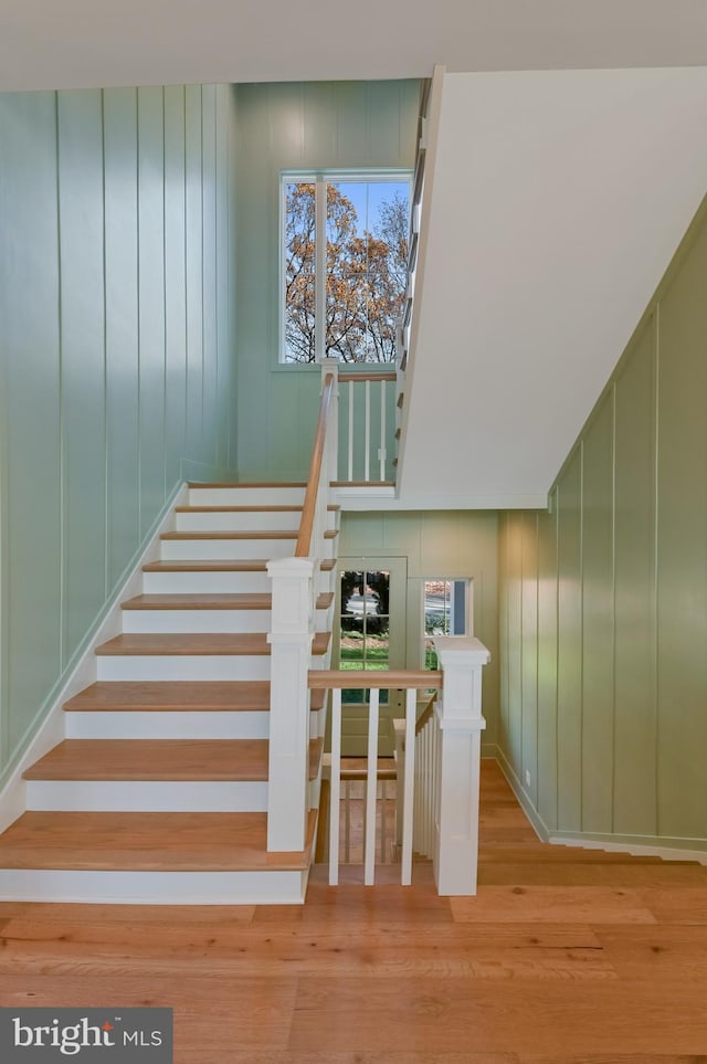 stairway featuring wood-type flooring