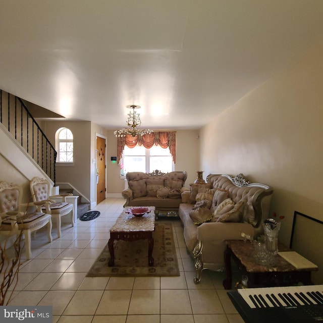 living room with an inviting chandelier and light tile patterned floors