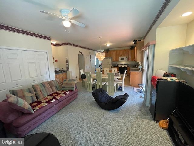 living room with light carpet and ceiling fan