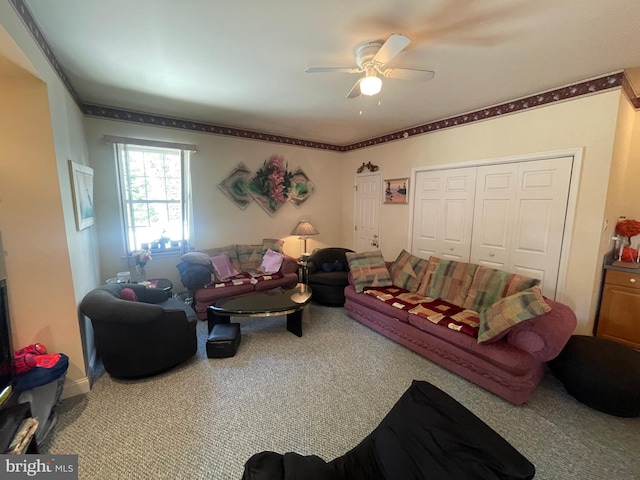 living room featuring carpet flooring and ceiling fan