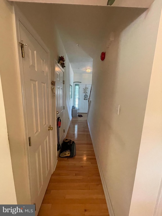 corridor featuring light hardwood / wood-style flooring