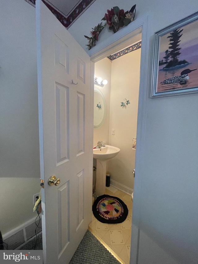 bathroom with tile patterned flooring