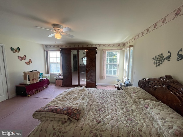 carpeted bedroom with ceiling fan