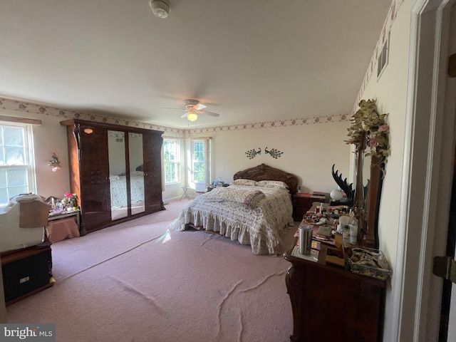 carpeted bedroom with ceiling fan